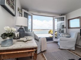 A living room with a view of the water at Mariners Cottage in Bideford
