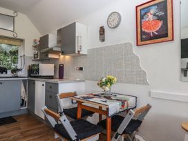 A kitchen with a table and chairs at The Old Telephone Exchange in Exeter