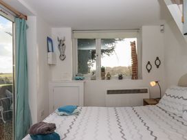 A bedroom with a bed and decorative items at The Old Telephone Exchange in Exeter