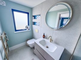 A bathroom with a sink and toilet at Pengarnedd in Amlwch