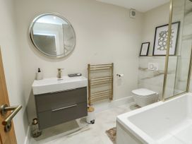 A bathroom with a tub and sink at Pengarnedd in Amlwch