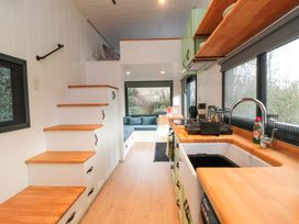 A kitchen with a sink and countertop at The Tiny Home 