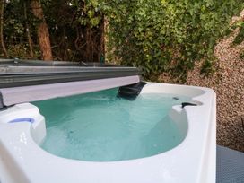 A hot tub with water inside at The Tiny Home