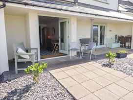An outdoor space with seating and a table at Ty Mor in Newport, Pembrokeshire