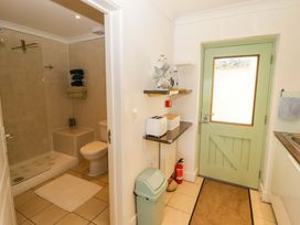 A bathroom with a shower and toilet at Ty Mor in Newport, Pembrokeshire