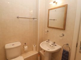 A bathroom with a toilet and washbasin at Ty Mor in Newport, Pembrokeshire