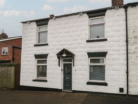 A house with a front door and windows at Seabreeze in Filey