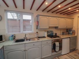 A kitchen with cabinets and appliances at Seabreeze in Filey
