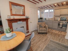 A kitchen with a table and chairs at Seabreeze in Filey
