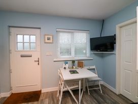 A dining area with a table and chairs at Long Jack's, Ballygarrett, County Wexford