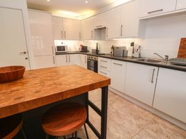 A kitchen with a countertop and appliances at 11 Fountain Court in Falmouth