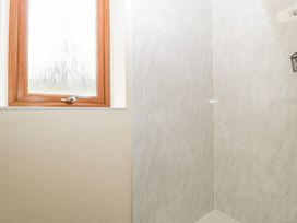 A shower with a window at Orchard Cottage in Ledbury