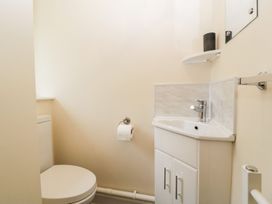 A bathroom with a toilet and sink at Orchard Cottage in Ledbury