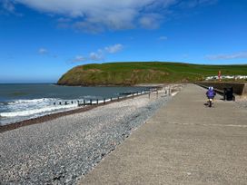 A child riding a bicycle along a coastal pathway at Somerby in St. Bees