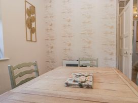 A dining room with a table and chairs at Somerby in St Bees