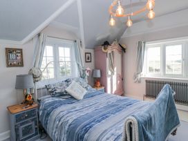 A bedroom with a bed and bedside table at Somerby in St Bees