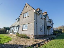 A house with a stone pathway and garden at Somerby in St Bees