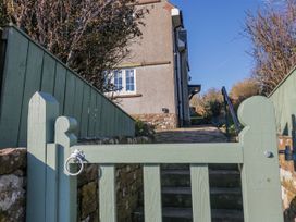 A gate and steps leading to a house at Somerby in St Bees