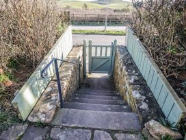 A staircase leading to a gate and pathway at Somerby St Bees