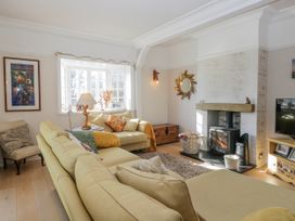 A living room with a sofa and fireplace at Somerby in St Bees