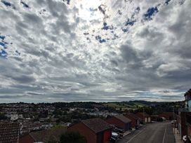 A view of clouds and hills from a parking area at Upper Longlands Dawlish