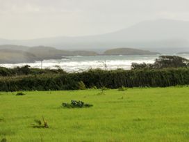 A landscape view of waves and greenery at Getws in Ty Croes