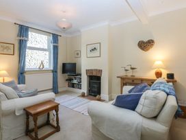 A living room with a sofa and television at 15 Rose Hill Beaumaris