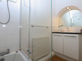 A bathroom with a shower and sink at 15 Rose Hill Beaumaris