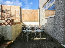 An outdoor area with a table and chairs at 15 Rose Hill Beaumaris