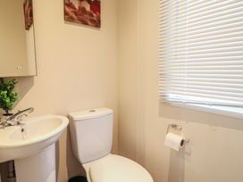A bathroom with sink and toilet at Gorse Hill 211 Exmouth