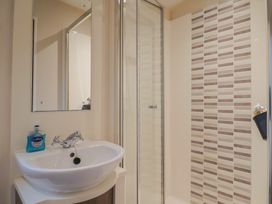 A bathroom with a sink and shower at Gorse Hill 211 in Exmouth