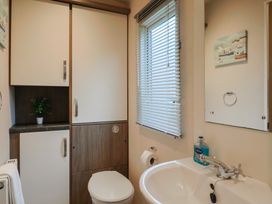 A bathroom with a sink and toilet at Gorse Hill 211 Exmouth