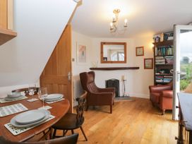 A dining room with a table and chairs at The Spinney near Milnthorpe