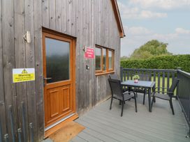 An outdoor area with a table and chairs at James Ville Marina Lodge 7 in Brigg