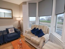 A living room with a sofa and armchair at South Villa Sandsend near Whitby