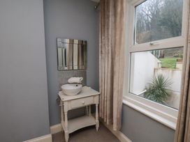 A bathroom with a sink and mirror at South Villa in Sandsend near Whitby