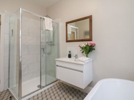 A bathroom with a shower and sink at South Villa Sandsend near Whitby