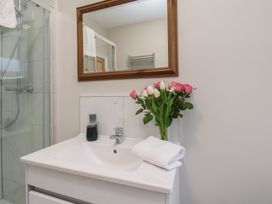 A bathroom with sink and mirror at South Villa Sandsend near Whitby