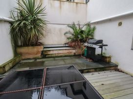An outdoor area with a grill and planters at South Villa Sandsend near Whitby