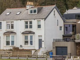 A house with a staircase and fence at South Villa Sandsend near Whitby