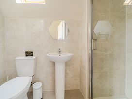 A bathroom with a toilet and sink at James Ville Marina Lodge 13 in Brigg