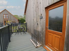 An outdoor area with a wooden door and seating at James Ville Marina Lodge 14, Brigg