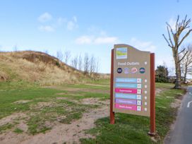 A sign displaying food outlets and amenities in Prestatyn