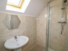 A bathroom with shower and sink at James Ville Marina Lodge 10 in Brigg
