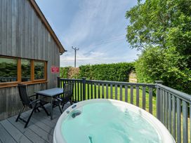 An outdoor area with a hot tub and furniture at James Ville Marina Lodge 10 in Brigg