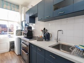 A kitchen with appliances and countertop at Apartment 2 in Scarborough