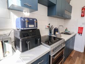 A kitchen with appliances including a toaster and air fryer at Apartment 2 in Scarborough