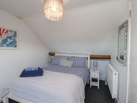 A bedroom with a bed and bedside table at Apartment 3 in Scarborough