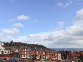 A view of houses and the sea at Apartment 3 in Scarborough