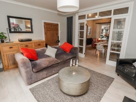 A living room with a sofa and coffee table at The Secret Garden in Narberth